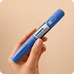 person holding Ozempic injection